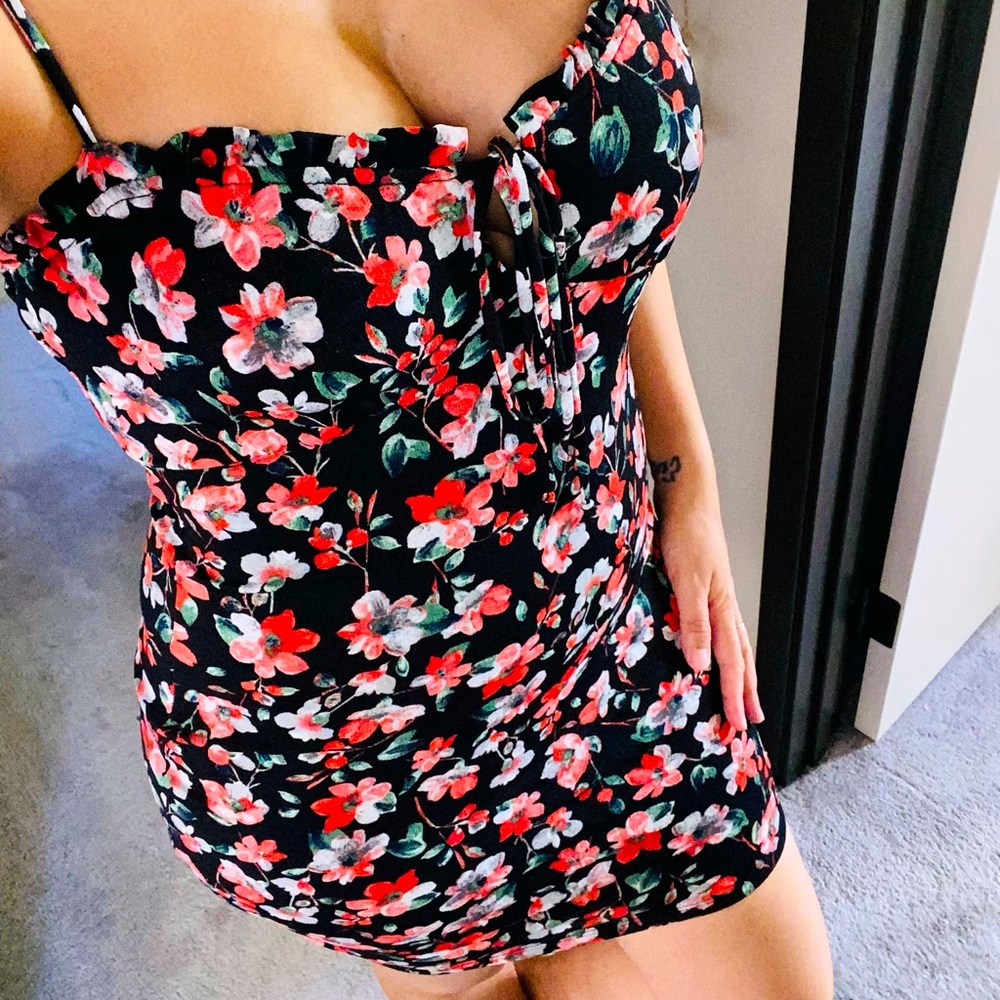 Black mini dress with red floral print.